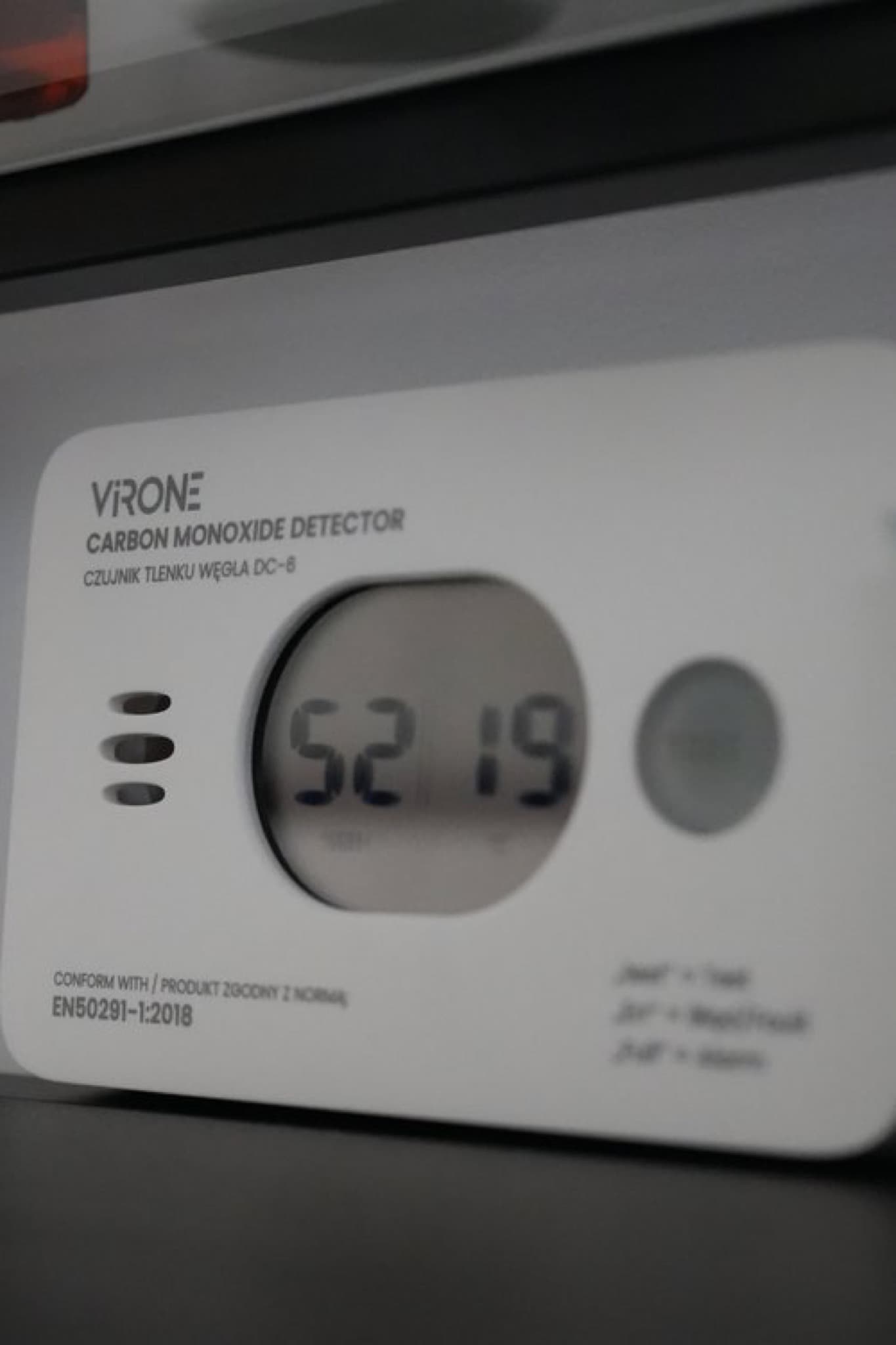 Virone carbon monoxide detector close-up with 52% humidity and 19°C reading