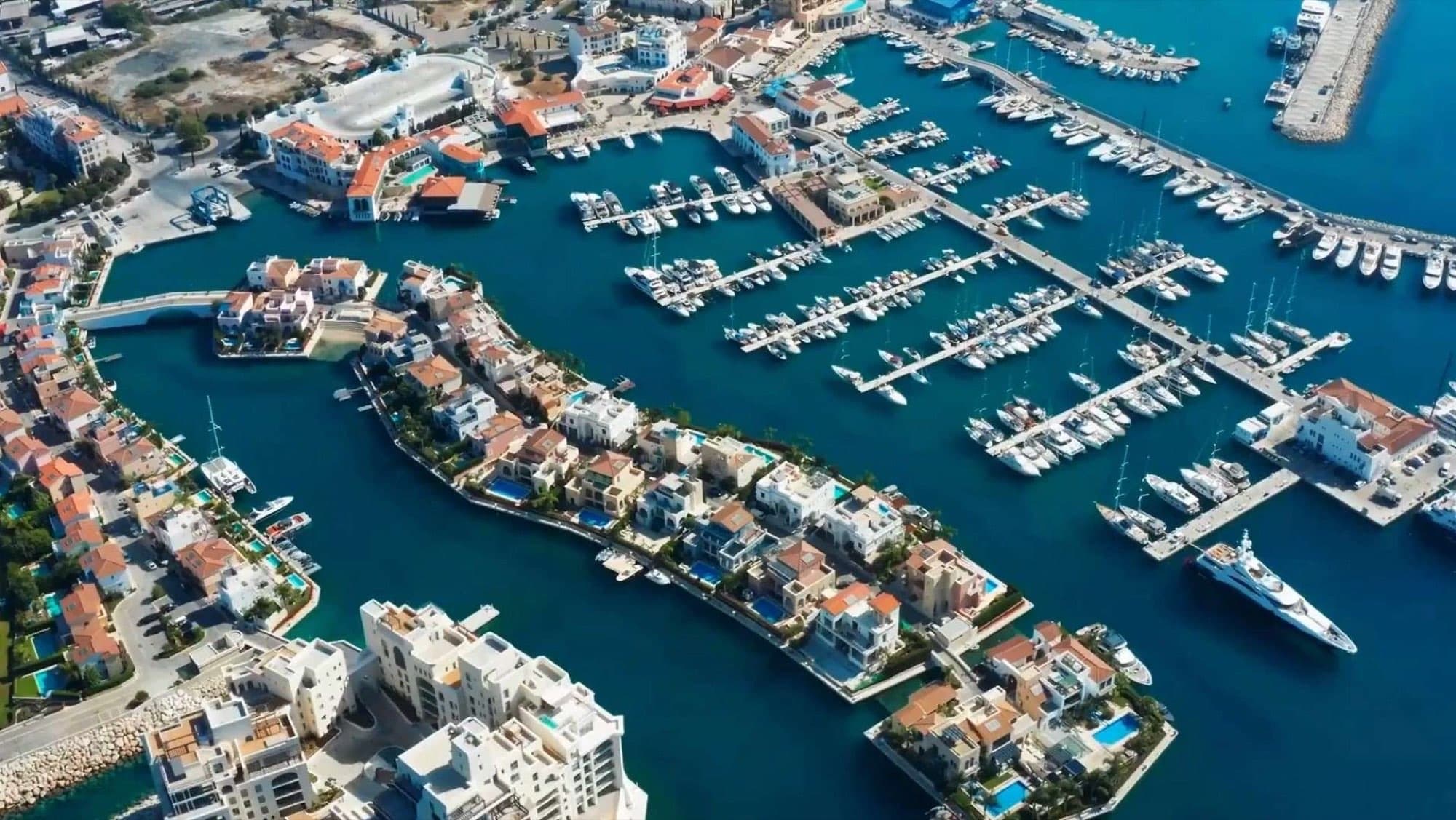 Aerial view of Limassol Marina's yacht berths and waterfront apartment buildings